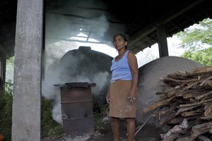 File - A picture of a member of the MAGU women's pottery workshop located at La Arada Goascoran community, Municipality of Nacaome, Valle, Honduras. In MAGU 9 women, who have gone through experience of domestic / interfamilial violence, work together for the production of traditional pottery.