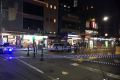 Police at the scene of a stabbing in Melbourne's CBD on Monday morning.