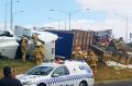 Emergency services at the scene of a truck rollover in North Geelong.