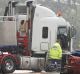 An accident involving a sedan and a truck on the Princes Highway near Berry, NSW, last year.