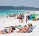 People being turned away and forced to park miles away from the beach due to overcrowding.