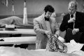 San Francisco homicide inspectors David Toschi, left, and William Armstrong go through a murder victim's clothes at the ...