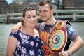 Next stop, Las Vegas: Jeff Horn is joined by wife Jo at a press conference after defending his WBO welterweight title belt.