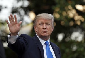 President Donald Trump waves as he walks to Marine One as he departs the White House, Wednesday, July 12, 2017, in Washington. Trump is headed to Paris for Bastille Day.