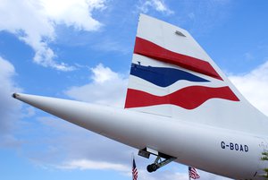 New York Harbor, N.Y. (Nov. 24, 2003). The British Airways Concorde Jet passes the Statue of Liberty in New York Harbor on its way to the USS Intrepid Air & Space Museum.