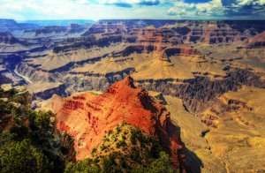 The Grand Canyon is a colorful steep-sided gorge carved by the Colorado River in the U.S. state of Arizona. It is largely contained within the Grand Canyon National Park — one of the first national parks in the United States