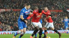 Manchester United's Romelu Lukaku, right holds off the challenge of Stoke City's Kevin Wimmer as he turns to shot and ...