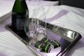 Champagne sits on a business class seat of a Singapore Airlines Ltd. Airbus SE A380 aircraft with refitted cabins during ...