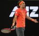 Footloose: Ukraine's Alexandr Dolgopolov gestures to the umpire after his shoe came off during his second round match ...