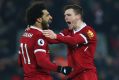 Liverpool's Andrew Robertson (right) celebrates with Mohamed Salah after Salah scored his side's fourth goal.