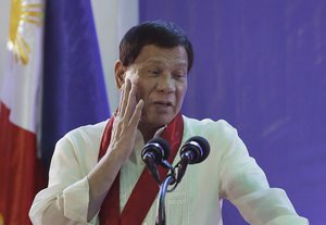 Philippine President Rodrigo Duterte gestures during his speech at the 113th Founding Anniversary of the Bureau of Internal Revenue in metropolitan Manila, Wednesday Aug. 2, 2017.