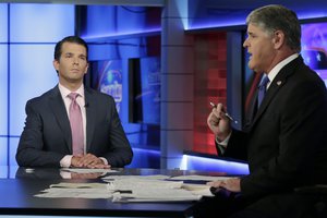 Donald Trump Jr., left, is interviewed by host Sean Hannity on his Fox News Channel television program, in New York Tuesday, July 11, 2017.