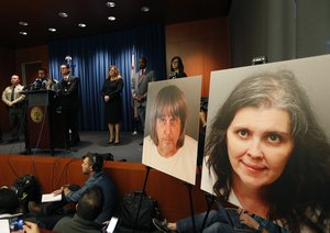 Riverside County District Attorney Mike Hestrin, at podium, takes questions from the media at a news conference in Riverside, Calif., Thursday, Jan. 18, 2018.