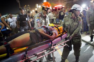 Firefighters carry a woman on a stretcher after a car drove into the crowded seaside boardwalk along Copacabana beach in Rio de Janeiro, Brazil, Thursday, Jan. 18, 2018.