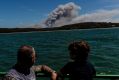 A bushfire burning in the Royal National Park is seen from the Cronulla-to-Bundeena Ferry.