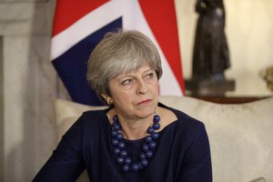 British Prime Minister Theresa May turns to listen to a translator during her meeting with Spanish Prime Minister Mariano Rajoy inside 10 Downing Street in London, Tuesday, Dec. 5, 2017.