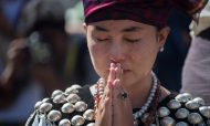 A woman wearing traditional dress from Kachin state in Myanmar sheds a tear as she prays outside St. Mary's Cathedral during a mass led by Pope Francis in Yangon on November 30, 2017. Photo: AFP