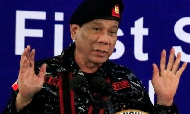 Philippine President Rodrigo Duterte, wearing a military uniform, gestures as he delivers a speech on November 24, 2017. Photo: Reuters/Romeo Ranoco