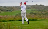 Donald Trump plays a stroke as he officially opens his new multi-million pound Trump International Golf Links course in Aberdeenshire, Scotland, on July 10, 2012. Photo: AFP / Andy Buchanan