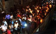 People take part in a candlelight vigil on Monday in memory of those who lost their lives in the stampede on Friday at Mumbai’s Elphinstone station.  Photo: The Hindu