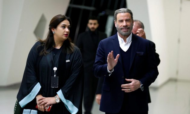 Actor John Travolta waves as he arrives at APEX Convention Center in Riyadh, Saudi Arabia on December 15, 2017. Photo: Reuters / Faisal al Nasser