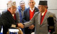 CPN-UML chairman Khadga Prasad Sharma Oli (left) shakes hands with the chairman of the Communist Party of Nepal (Maoist Centre), Pushpa Kamal Dahal, aka Prachanda, during a news conference in Kathmandu on December 17, 2017.  Photo: Reuters / Navesh Chitrakar