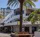 The tiny property is located in this commercial building on Cavill Avenue, Surfers Paradise.