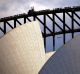 REFILE - CORRECTING TYPO The roof of the Sydney Opera House is pictured as a JetStar Airlines Airbus A320 plane flies ...