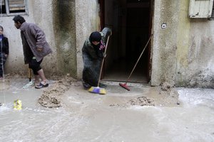 A heavy rain that flooded their houses in Rafah in the southern Gaza Strip.