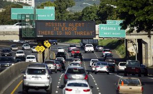 In this Saturday, Jan. 13, 2018 file photo provided by Civil Beat, cars drive past a highway sign that says "MISSILE ALERT ERROR THERE IS NO THREAT" on the H-1 Freeway in Honolulu.