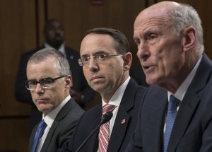 From left, FBI Acting Director Andrew McCabe, Deputy Attorney General Rod Rosenstein, and Director of National Intelligence Dan Coats, testify as the Senate Intelligence Committee discusses gathering intelligence on foreign agents and will likely be asked about Russia's election meddling and whether the president has tried to influence ongoing investigations. gathering intelligence on foreign agents and will likely be asked about Russia's election meddling and whether the president has tried to influence ongoing investigations, on Capitol Hill in Washington, Wednesday, June 7, 2017