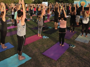 People practise Mass Mala Yoga during the Dubai Fitness Challenge Opening Carnival