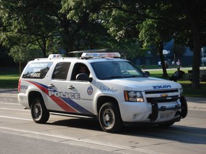 Toronto Police Service Emergency Task Force vehicle on Queen Street, with "POLICE" in mirror writing ("ECILOP").