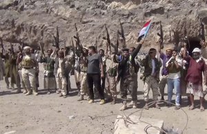 This frame grab from video shows fighters loyal to the separatist so-called Southern Transitional Council, backed by the United Arab Emirates, chanting after taking control of Mount Hadid in Aden which was controlled by forces loyal to President Abed Rabbo Mansour Hadi, in Aden Yemen, Tuesday, Jan. 30, 2018.