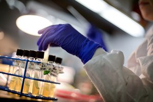 Microbiologist Tatiana Travis works with tubes of bacteria samples in an antimicrobial resistance and characterization lab within the Infectious Disease Laboratory at the federal Centers for Disease Control and Prevention