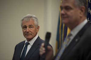 Secretary of Defense Chuck Hagel waves hello as he arrives  at a reception hosted by members of  Veterans Service Organizations at the Veterans of Foreign Wars building in Washington D.C.,  Jan. 27, 2015. The group honored Secretary Hagel for everything he has done while in office and in turn Secretary Hagel thanked the group for everything they do for service members. (Photo by Master Sgt. Adrian Cadiz)(Released)