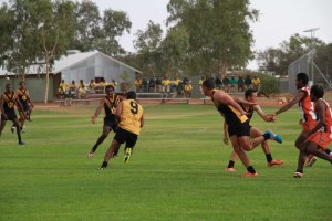 Prison inmates tackle domestic violence with footy (ABC News)