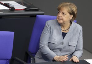 German Chancellor Angela Merkel attends a meeting of the German Federal Parliament, Bundestag, at the Reichstag building in Berlin, Germany, Thursday, Feb. 1, 2018.