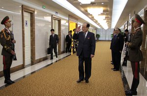 North Korean Chairman of the Presidium of the Supreme People's Assembly Kim Yong Nam, center, walks through the Pyongyang International Airport, Tuesday, Aug. 4th, 2015, in Pyongyang, North Korea.