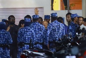 Policemen arrest former Maldives president and opposition leader Maumoon Abdul Gayoom, center, after the government declared a 15-day state of emergency in Male, Maldives, early Tuesday, Feb. 6, 2018.