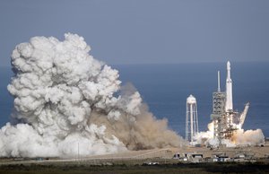 A Falcon 9 SpaceX heavy rocket lifts off from pad 39A at the Kennedy Space Center in Cape Canaveral, Fla., Tuesday, Feb. 6, 2018.