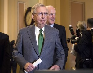 Senate Majority Leader Mitch McConnell, R-Ky., and Majority Whip John Cornyn, R-Texas, right, arrive to speak to reporters following a closed-door strategy session that included Vice President Mike Pence, on Capitol Hill in Washington, Tuesday, Nov. 7, 2017.