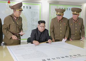 In this file image made from video of an Aug. 14, 2017, broadcast in a news bulletin by North Korea's KRT, North Korean leader Kim Jong Un receives a military briefing in Pyongyang.