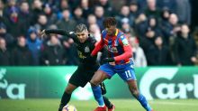 Crystal Palace's Wilfried Zaha, right, and Newcastle United's DeAndre Yedlin battle for the ball during the English ...