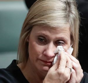 Labor MP Susan Lamb wipes away tears after delivering a statement on her citizenship after Question Time at Parliament ...