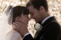 Ana (Dakota Johnson) and Christian (Jamie Dornan​) are married in <i>Fifty Shades Freed</i>. 