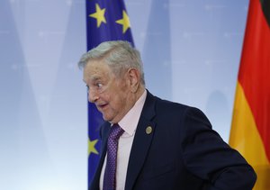 Hungarian-American investor George Soros leaves after a press conference prior to the launch event for the European Roma Institute for Arts and Culture at the Foreign Ministry in Berlin, Germany, Thursday, June 8, 2017.