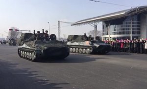 This image taken from video footage provided by Paektu Cultural Exchange shows military vehicles through streets in Pyongyang, North Korea, Thursday, Feb. 8, 2018.