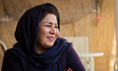 Laila Haidary sits at one of the tables in her restaurant in Kabul, Afghanistan 2017.