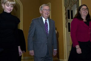 Senate Majority Leader Mitch McConnell, R-Ky., walks to the senate chamber minutes before the midnight, at the Capitol, Thursday, Feb. 8, 2018, in Washington.